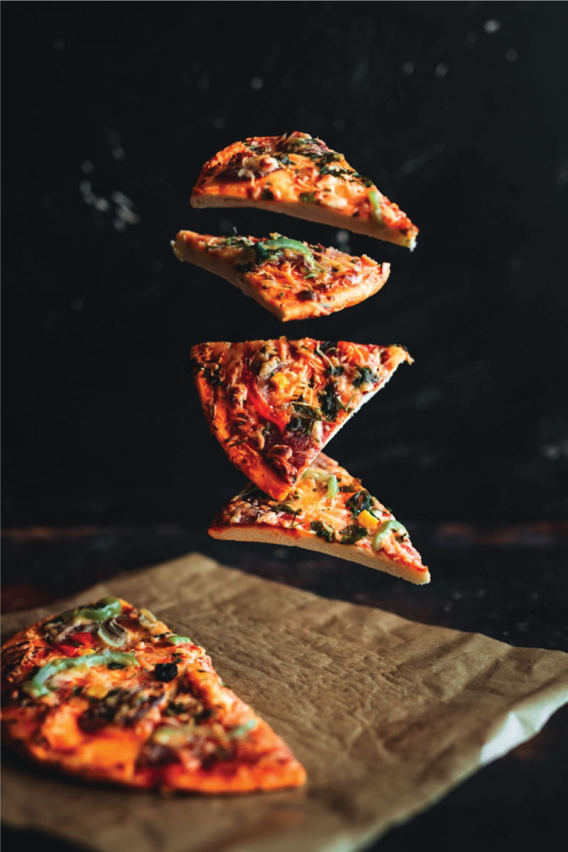  pizza on black background.